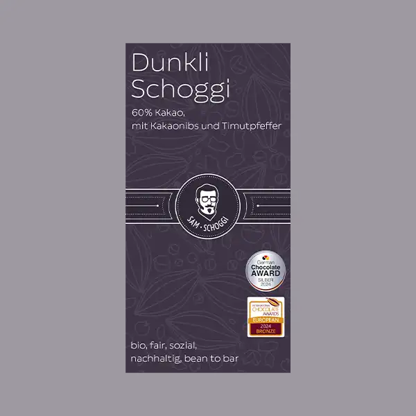 violette Verpackung Dunkli Schoggi Kakaonibs und Timutpfeffer