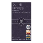 graue Verpackung "Dunkli Schoggi" mit Kakaonibs und Timutpfeffer